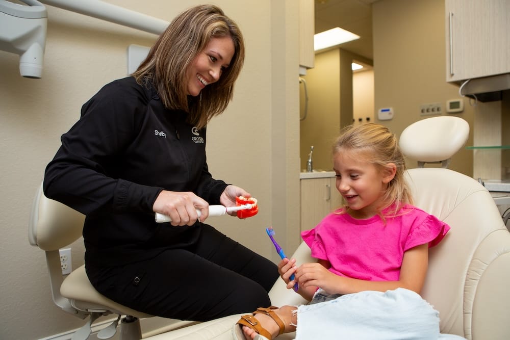 Happy mother and child at the dentist